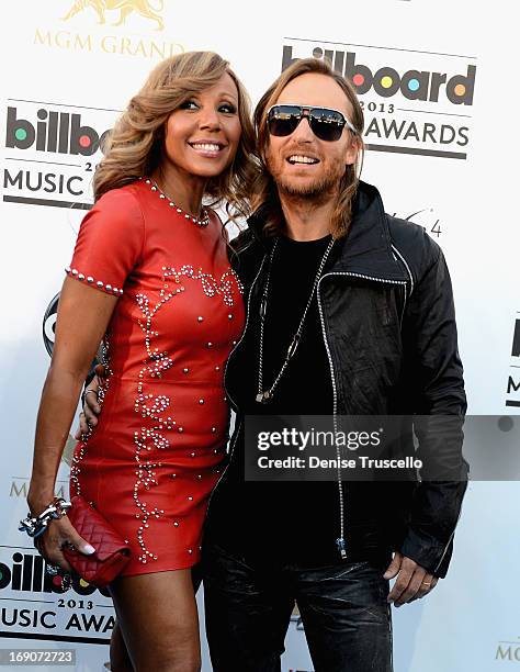 David Guetta and Cathy Guetta arrive at the 2013 Billboard Music Awards at the MGM Grand Garden Arena on May 19, 2013 in Las Vegas, Nevada.