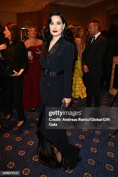 Dita Von Teese attends the 'Global Gift Gala' 2013 cocktail presented by Eva Longoria at Carlton Hotel on May 19, 2013 in Cannes, France.