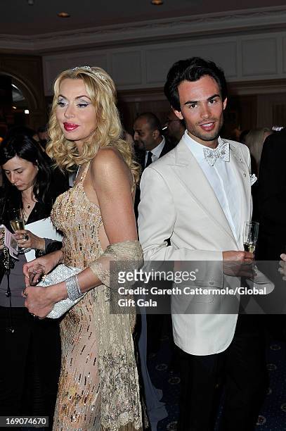 Valeria Marini and Mark-Francis Vandelli attends the 'Global Gift Gala' 2013 cocktail presented by Eva Longoria at Carlton Hotel on May 19, 2013 in...