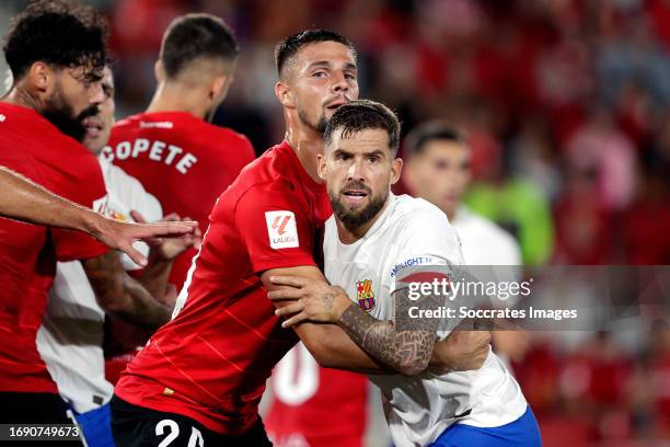 Martin Valjent of Real Mallorca, Inigo Martinez of FC Barcelona during the LaLiga EA Sports match between Real Mallorca v FC Barcelona at the Visit...