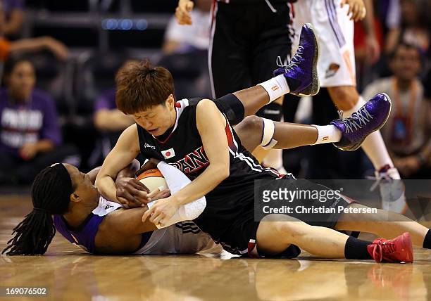 Alexis Hornbuckle of the Phoenix Mercury and Yuko Oga of Japan battle for a loose ball during the preseason WNBA game at US Airways Center on May 19,...