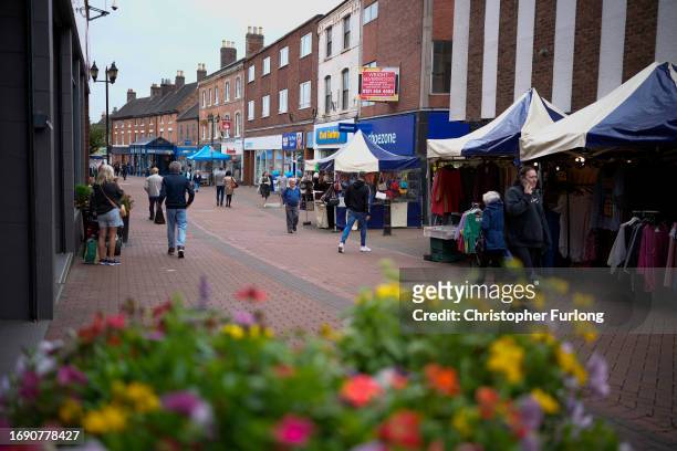 Shoppers walk through Tamworth town centre as it leads up to a by-election on September 19, 2023 in Tamworth, England. The by-election for the...