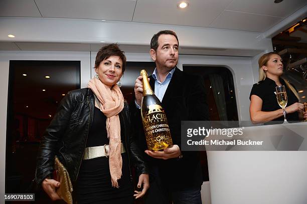 Nicholas Frank and a guest attend the Glacier Films launch party hosted by Hayden C and Michael Saylor aboard the Yacht Harle on May 19, 2013 in...