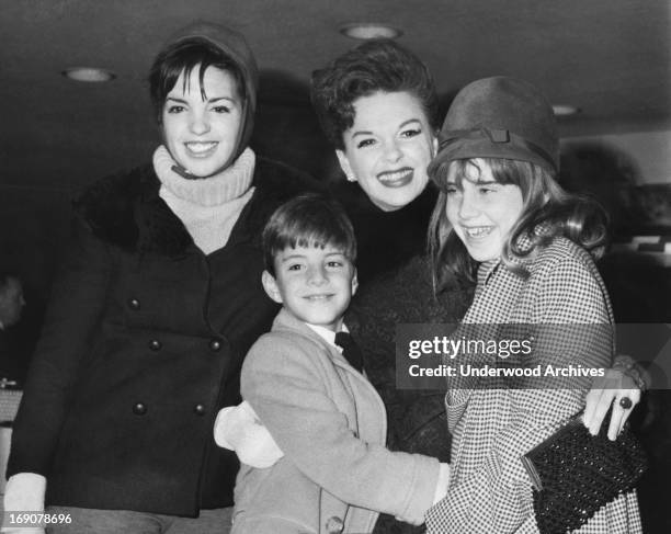 Judy Garland with all three of her children at JFK Airport, New York, New York, 1964. Left is Lisa Minnelli, and Joey and Lorna Luft.