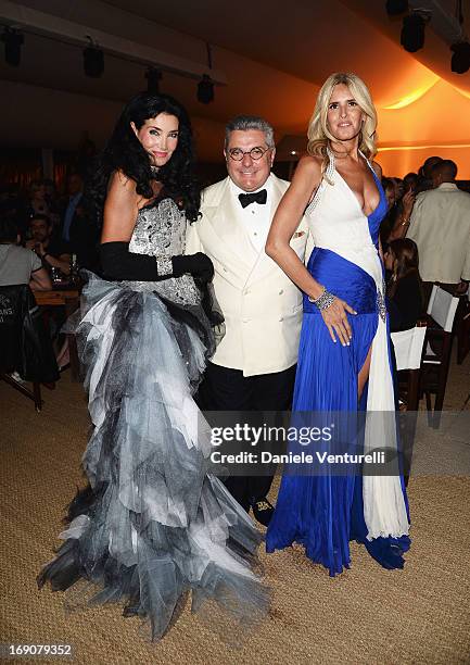 Lamia Khashoggi, Nunzio Alfredo D'Angieri and Tiziana Rocca attend the Eva Longoria Global Gift Gala after party hosted by Nikki Beach Cannes during...