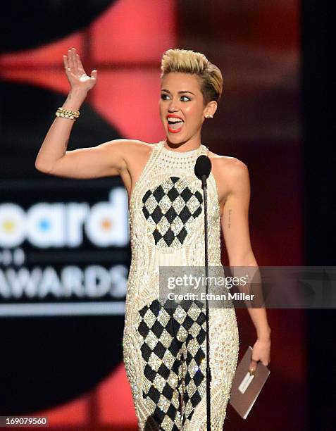 Singer Miley Cyrus speaks onstage during the 2013 Billboard Music Awards at the MGM Grand Garden Arena on May 19, 2013 in Las Vegas, Nevada.