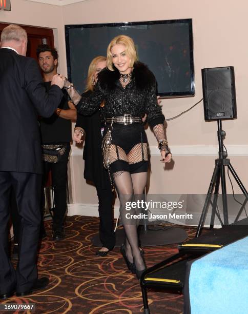 Madonna poses in the press room during the 2013 Billboard Music Awards at the MGM Grand Garden Arena on May 19, 2013 in Las Vegas, Nevada.