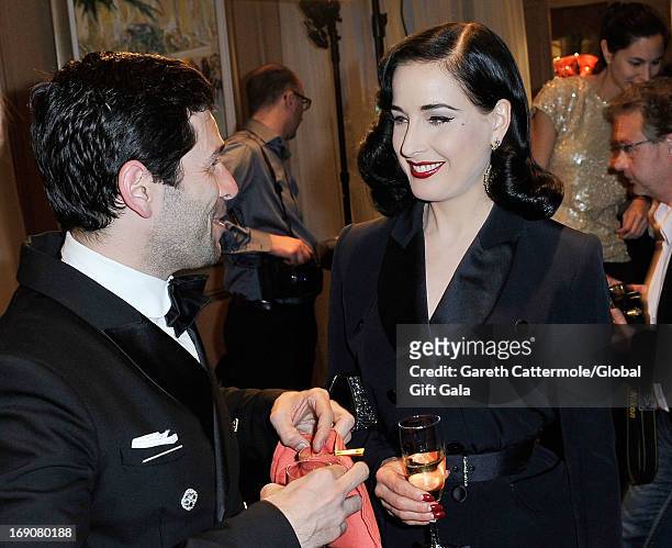Dita Von Teese attends the 'Global Gift Gala' 2013 cocktail presented by Eva Longoria at Carlton Hotel on May 19, 2013 in Cannes, France.