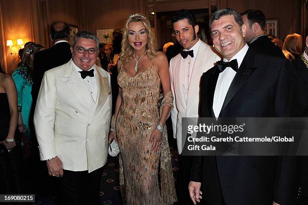 Nunzio Alfredo D'Angieri, Valeria Marini, Stefan John Charles and a guest attend the 'Global Gift Gala' 2013 cocktail presented by Eva Longoria at...