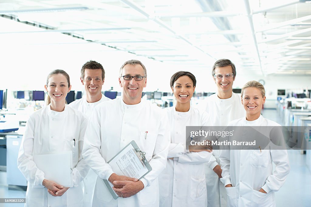 Scientists smiling together in lab