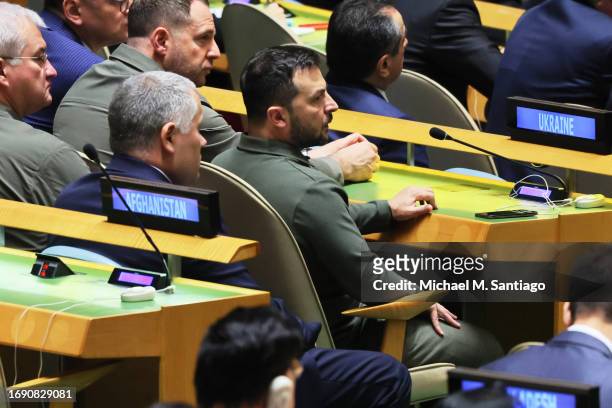 President of Ukraine Volodymyr Zelenskyy listens as UN Secretary General Antonio Guterres speaks during the United Nations General Assembly at the...