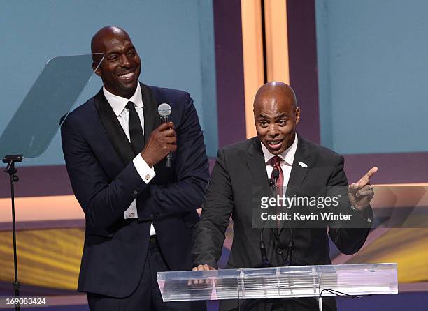 Personality and show host Kevin Frazier and retired NBA player and radio host John Salley speak onstage at the 28th Anniversary Sports Spectacular...