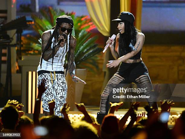 Rapper Lil Wayne and recording artist Nicki Minaj perform onstage during the 2013 Billboard Music Awards at the MGM Grand Garden Arena on May 19,...