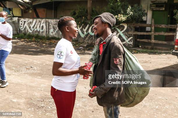 Volunteer distributes free condoms to a man in the street during the national celebrations of The World Contraception Day. According to data from...