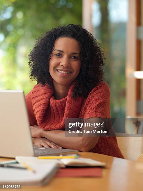Using Loptop Woman Using Loptop On Patio High-Res Stock Photo - Getty Images