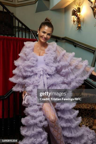 Helena Christensen poses at the BFC x AlUla Creates: Atelier Hekayat and Aram Designs Presentation during London Fashion Week September 2023 at The...