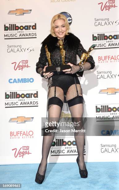 Madonna poses in the press room during the 2013 Billboard Music Awards at the MGM Grand Garden Arena on May 19, 2013 in Las Vegas, Nevada.
