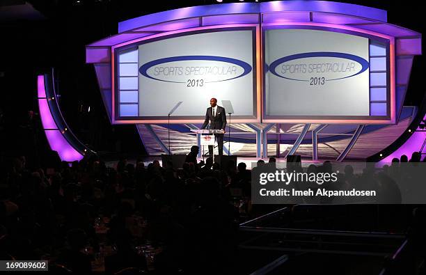 Retired NBA player and radio host John Salley speaks at the podium during the 28th Anniversary Sports Spectacular Gala at the Hyatt Regency Century...