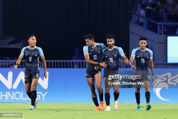 Rahul Kannoly Praveen of India celebrates his goal with teammates during the 19th Asian Game Men Group A match between China and India at Huanglong...