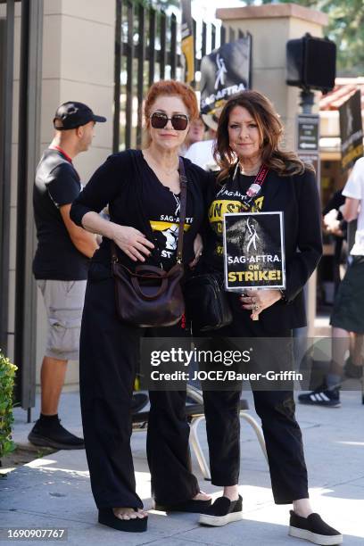 Lisa Ann Walter and Joely Fisher are seen on the SAG-AFTRA picket line on September 26, 2023 in Los Angeles, California.