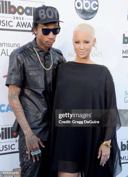 Rapper Wiz Khalifa and actress Amber Rose arrive at the 2013 Billboard Music Awards at MGM Grand Garden Arena on May 19, 2013 in Las Vegas, Nevada.