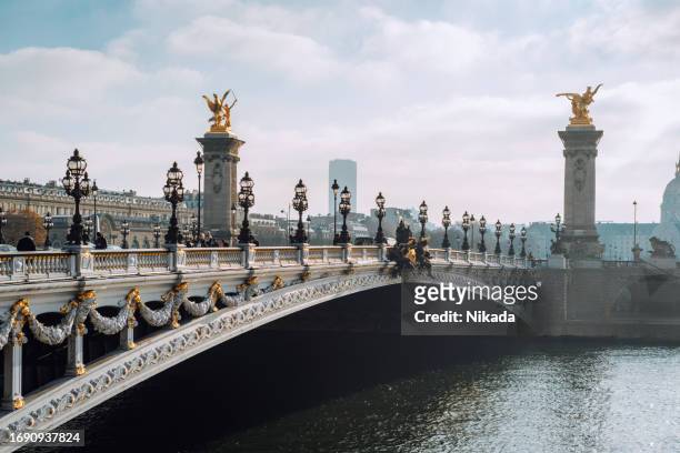 alexandre iii bridge in paris, france - hotel des invalides stock pictures, royalty-free photos & images
