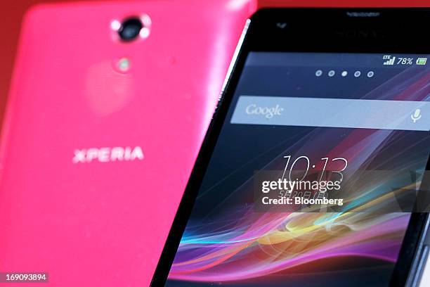 Corp.'s au brand Xperia UL SOL22 smartphones, manufactured by Sony Mobile Communications, are displayed during the unveiling of the company's new...