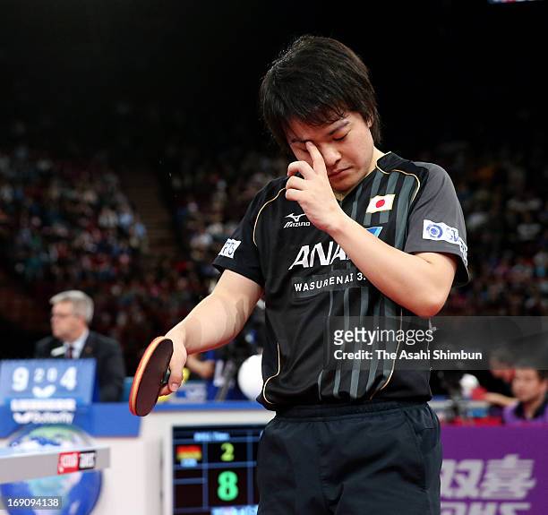 Seiya Kishikawa of Japan leaves as he lost in the Men's Singles Round of 16 match against Timo Boll of Germany during day six of the World Table...