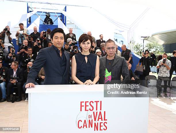 Actor Takao Osawa, actress Nanako Matsushima and Director Takashi Miike attend the photocall for 'Wara No Tate' at The 66th Annual Cannes Film...