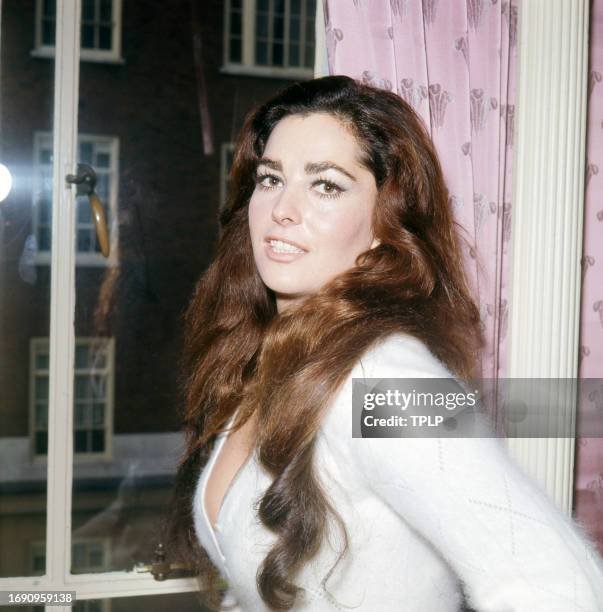 Portrait of American actress and model Edy Williams as she poses indoors, London, England, February 10, 1972.