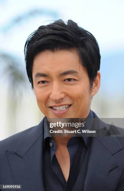 Actor Takao Osawa attends the photocall for 'Wara No Tate' at The 66th Annual Cannes Film Festival at Palais des Festivals on May 20, 2013 in Cannes,...