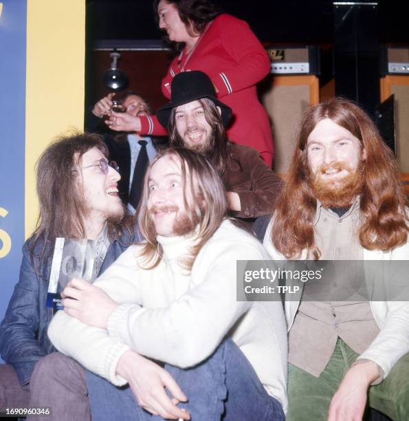 Portrait of the members of British Folk Rock group Lindisfarne as they pose in a studio, Newcastle, England, February 10, 1972. The band includes...