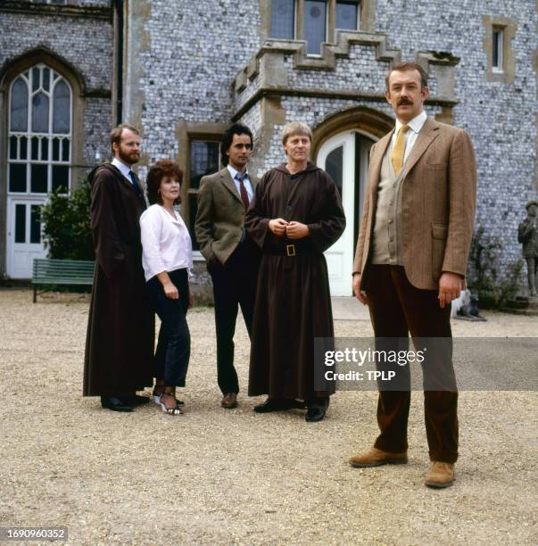 Portrait of cast members from the TV series 'The Black Tower' as they pose on set, London, England, September 10, 1985. Pictured are, from left,...