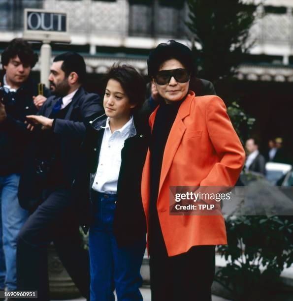 Portrait of musician Sean Ono Lennon and his mother, musician & artist Yoko Ono, as they pose on an unspecified street, London, England, March 20,...