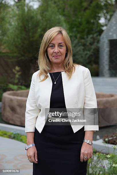 Cathy Ferrier, CEO of Sentebale poses in the B&Q Sentebale 'Forget-Me-Not' Garden at the Chelsea Flowert Show at the Royal Hospital Chelsea on May...