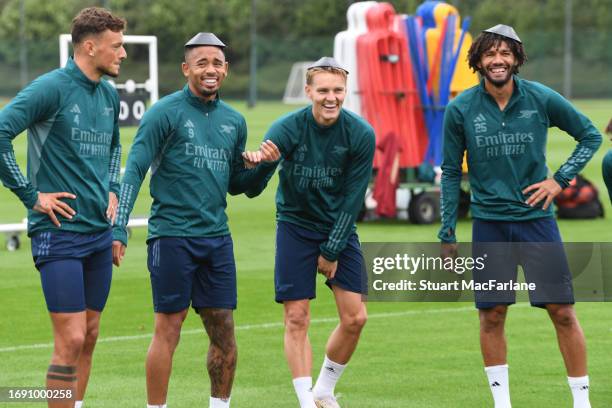 Ben White, Gabriel Jesus, Martin Odegaard and Mo Elneny of Arsenal during a training session at London Colney on September 19, 2023 in St Albans,...