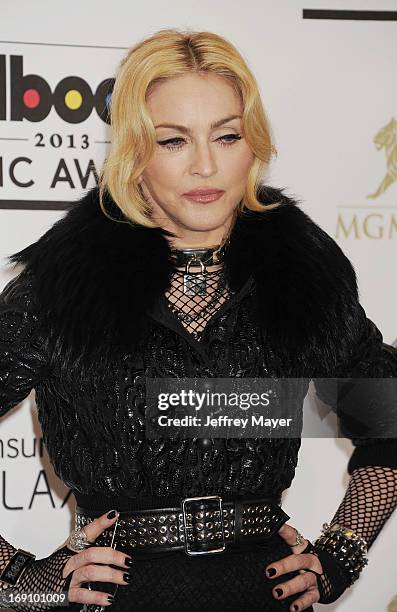 Singer Madonna poses in the press room at the 2013 Billboard Music Awards at MGM Grand Garden Arena on May 19, 2013 in Las Vegas, Nevada.