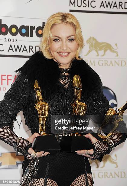Singer Madonna poses in the press room at the 2013 Billboard Music Awards at MGM Grand Garden Arena on May 19, 2013 in Las Vegas, Nevada.