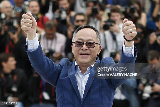 Chinese director Johnnie To gestures on May 20, 2013 while posing during a photocall for the film "Blind Detective" presented Out of Competition at...