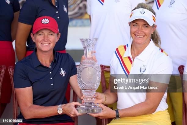 Stacy Lewis, captain of team USA and Suzann Pettersen, captain of team Europe hold the Solheim Cup trophy during an official photocall prior to the...