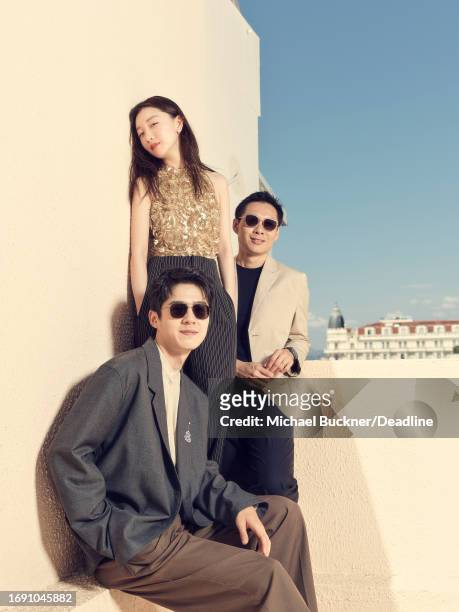 Haoran Liu, Zhou Dongyu and Anthony Chen of ‘The Breaking Ice’ pose for a portrait at the 76th Cannes Film Festival on May 22, 2023 in Cannes, France.