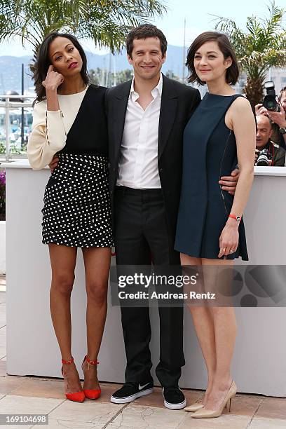 Actress Zoe Saldana, director Guillaume Canet and actress Marion Cotillard attends the photocall for 'Blood Ties' at The 66th Annual Cannes Film...