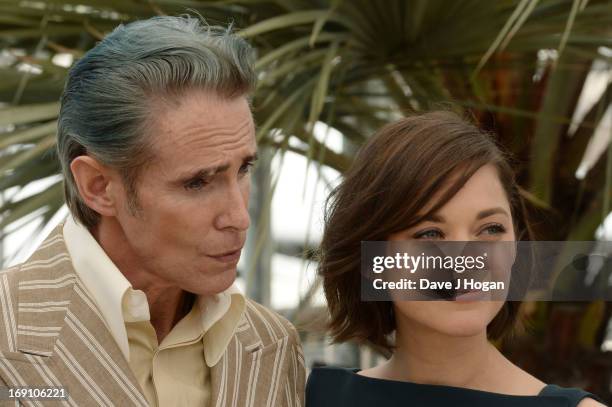 Actor Mark Mahoney and actress Marion Cotillard attend the photocall for 'Blood Ties' at The 66th Annual Cannes Film Festival on May 20, 2013 in...