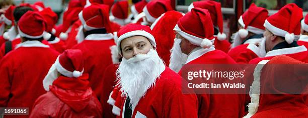 Some 100 men dressed as Santa Claus congregate in Hyde Park December 17, 2002 in London. Eight days before Christmas, the men were campaigning for...