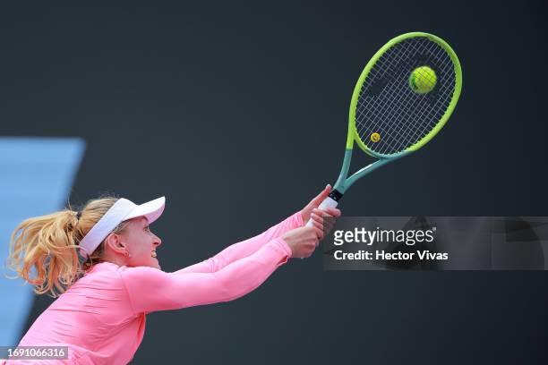 Aliaksandra Sasnovich of Belarus plays a backhand during the women's singles round of 32 match against Caroline Garcia of France as part of the day...