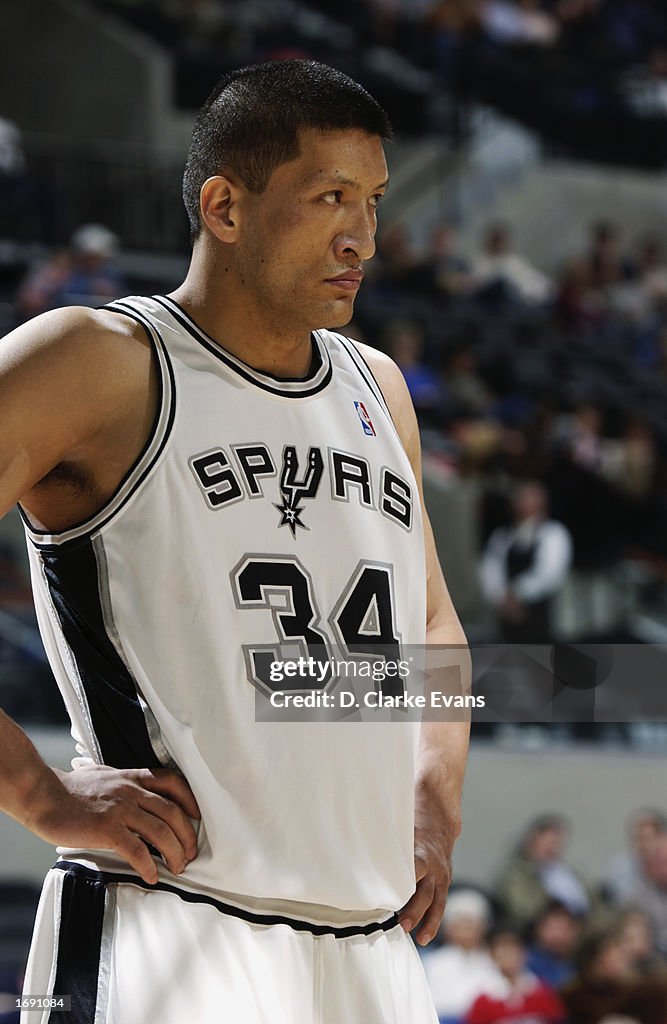 Mengke Mengke Bateer of the San Antonio Spurs stands during the game against ...