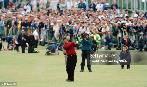 Tiger Woods of the USA plays his second shot at the 18th hole during the final round of the 2000 Open Championship held on the Old Course at St...