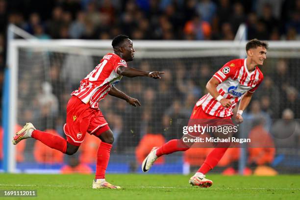 Osman Bukari of FK Crvena zvezda celebrates after scoring the team's first goal during the UEFA Champions League Group G match between Manchester...