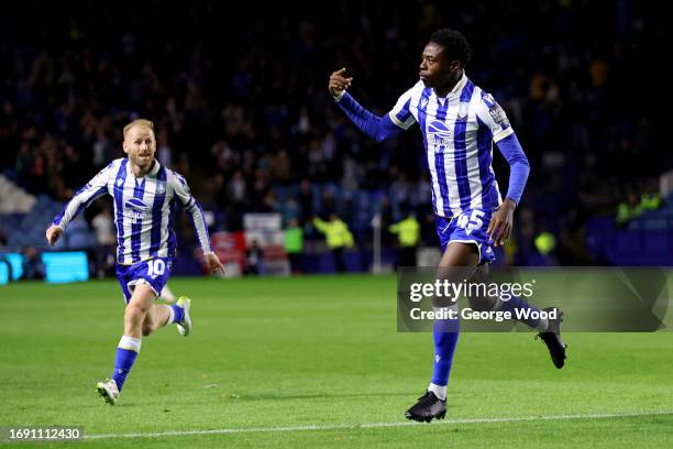 Anthony Musaba of Sheffield Wednesday celebrates with teammate Barry Bannan after scoring the team's first goal during the Sky Bet Championship match...