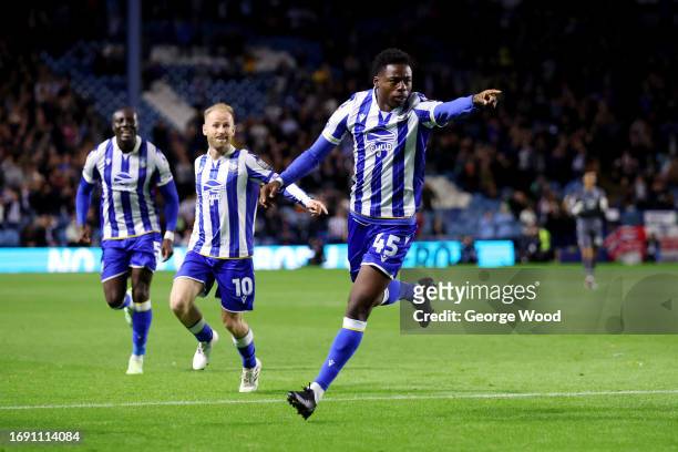 Anthony Musaba of Sheffield Wednesday celebrates with teammate Barry Bannan after scoring the team's first goal during the Sky Bet Championship match...